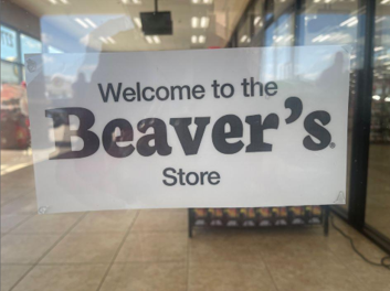 Picture of a sign on a glass door that says "Welcome to Beaver's Store"